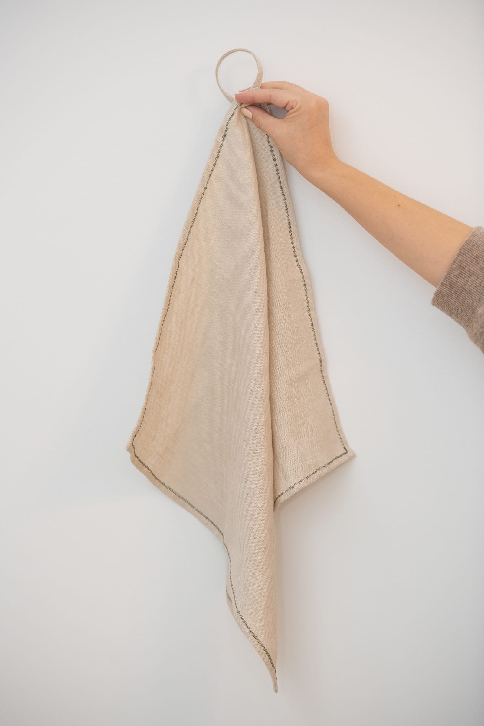 Warm OAT linen kitchen towel with a hand-stitched hanging hook